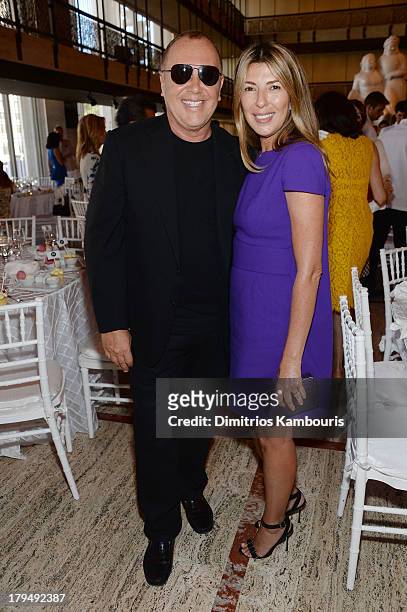 Designer Michael Kors and Nina Garcia attend The Couture Council of The Museum at the Fashion Institute of Technology hosted luncheon honoring...