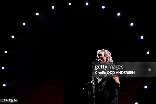 British musician and founding member of Pink Floyd, Roger Waters performs on stage during his "The Wall" show at the Olympic stadium in Berlin on...