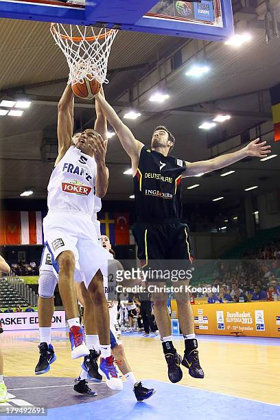 Nicolas Batum of France and Philip Zwiener of Gemany fight for the ball during the FIBA European Championships 2013 first round group A match between...