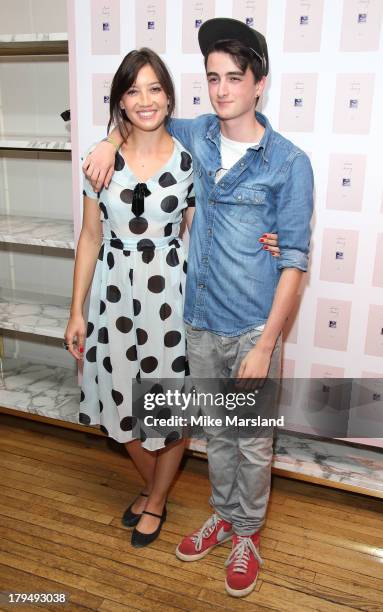 Alfie Goffey and Daisy Lowe attend as Alexa Chung celebrates the launch of her first book "It" at Liberty on September 4, 2013 in London, England.