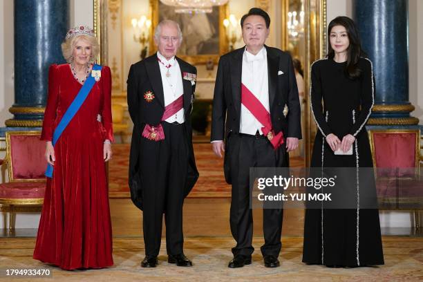 Britain's Queen Camilla, Britain's King Charles III, South Korea's President Yoon Suk Yeol and his wife Kim Keon Hee pose for pictures during a State...