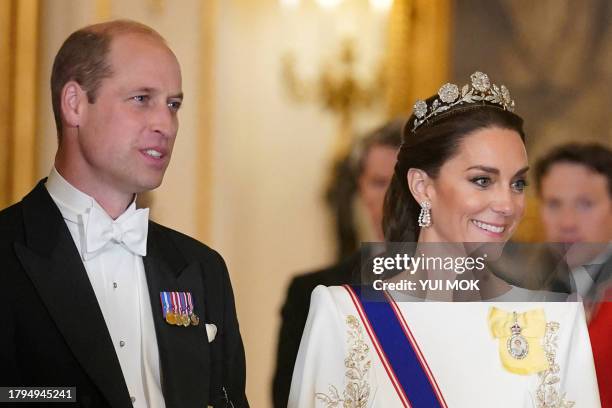 Britain's Prince William, Prince of Wales and Britain's Catherine, Princess of Wales arrive for a a State Banquet at Buckingham Palace in central...