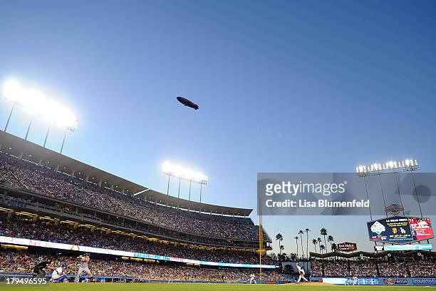 Goodyear blimp flies overhead as Will Middlebrooks of the Boston Red Sox bats against pitcher Carlos Marmol of the Los Angeles Dodgers at Dodger...