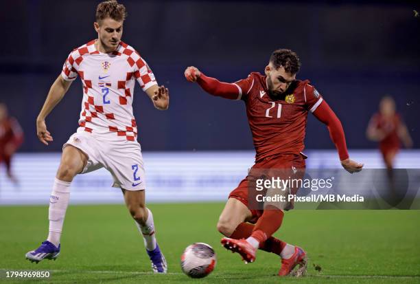 Nair Tiknizyan of Armenia and Josip Stanisic of Croatia in action during the UEFA EURO 2024 European qualifier match between Croatia and Armenia at...