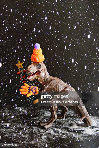 merry christmas and happy new year - dinosaur background stock pictures, royalty-free photos & images