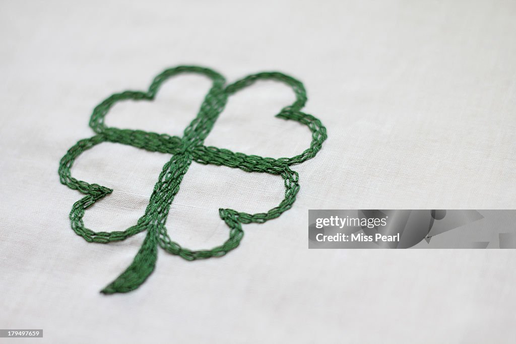 Green hand stitched four leaf clover for luck