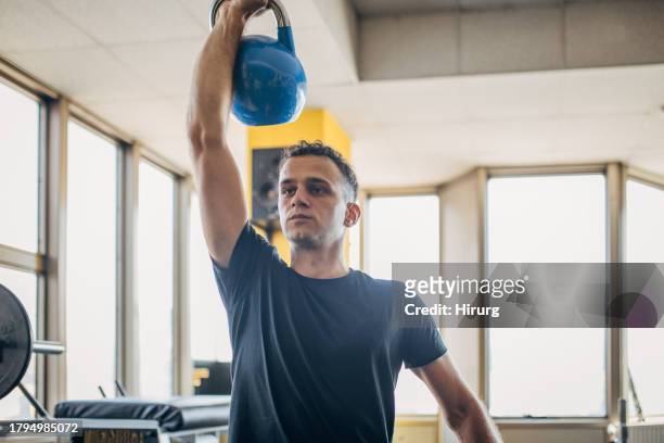 weightlifting exercise - kettle bell stock pictures, royalty-free photos & images