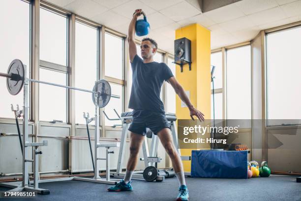 weightlifting exercise - kettle bell stock pictures, royalty-free photos & images