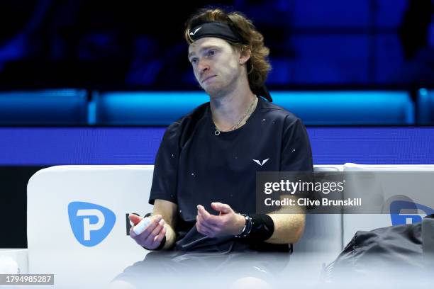 Andrey Rublev looks dejected after defeat to Carlos Alcaraz of Spain in the Men's Singles Round Robin match on day four of the Nitto ATP Finals at...