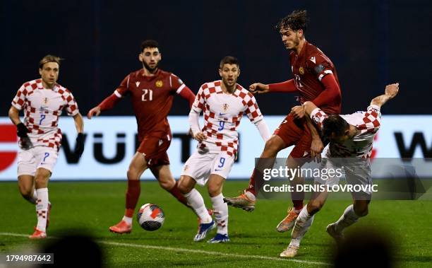 Croatia's forward Ante Budimir scores the opening goal during the UEFA Euro 2024 Group D qualification football match between Croatia and Armenia at...