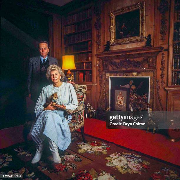 Lord John Fisher of Kilverstone and his wife Lady Rosamund Fisher of Kilverstone, seated in the drawing room of Kilverstone Hall on the family estate...