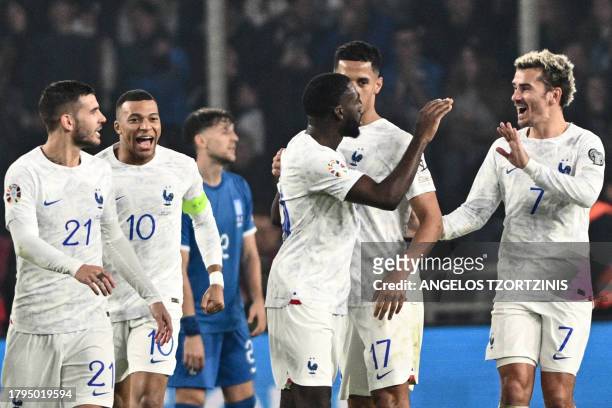 France's midfielder Youssouf Fofana celebrates with teammates after scoring his team's second goal during the UEFA Euro 2024 Group B second leg...
