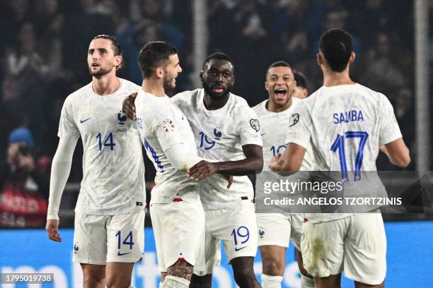 France's midfielder Youssouf Fofana celebrates with teammates after scoring his team's second goal during the UEFA Euro 2024 Group B second leg...