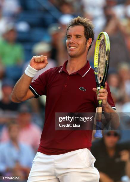 Richard Gasquet of France celebrates match point after his men's singles quarter-final match against David Ferrer of Spain on Day Ten of the 2013 US...