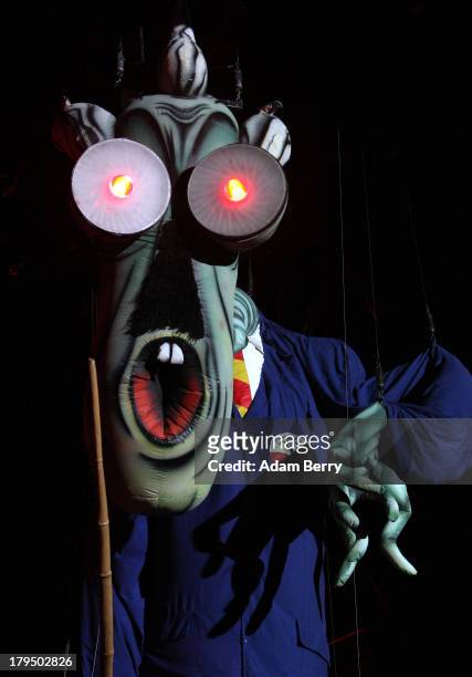 An 'evil teacher' puppet performs during a production of Roger Waters' 'The Wall' at Olympiastadion on September 4, 2013 in Berlin, Germany.