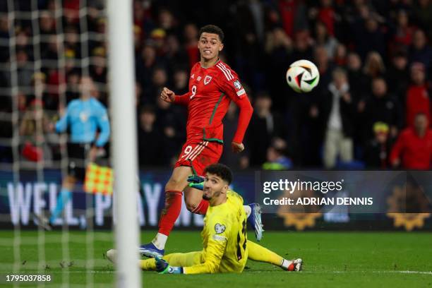 Wales' midfielder Brennan Johnson scores a goal but it's ruled out due to an offside position during the UEFA Euro 2024 Group D qualifying football...