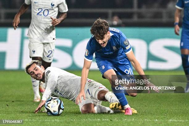 France's forward Antoine Griezmann fights for the ball with Greece's midfielder Ioannis Konstantelias during the UEFA Euro 2024 Group B second leg...