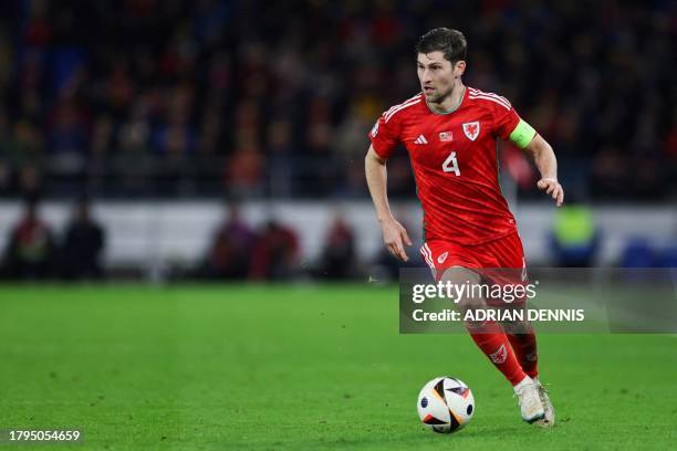 Wales' defender Ben Davies controls the ball during the UEFA Euro 2024 Group D qualifying football match between Wales and Turkey, at Cardiff City...