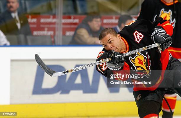 Jarome Iginla of the Calgary Flames fires a puck during the pre-game warmup before facing the Toronto Maple Leafs at Air Canada Centre on January 14,...