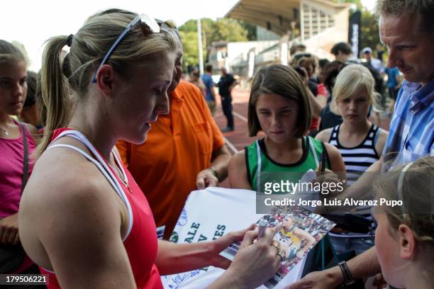Australian Athlete Sally Pearson signs autographs during the Adidas Kids Clinic of the IAAF Diamond League Memorial Van Damme meeting at the stadium...
