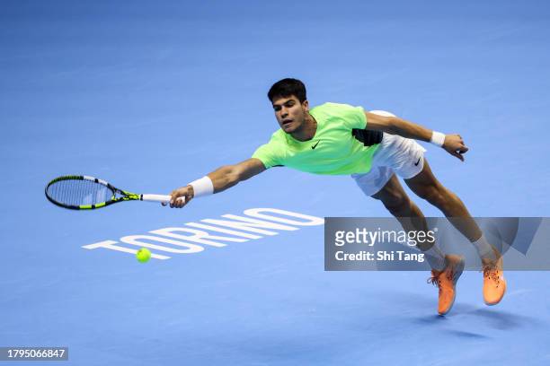 Carlos Alcaraz of Spain plays a forehand in the Men's Singles Round Robin match against Andrey Rublev during day four of the Nitto ATP Finals at Pala...