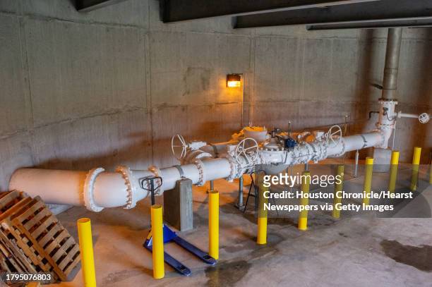The piping and valve assembly helps to regulate water pressure in the Sugar Land water distribution system by using gravity and the weight of the...