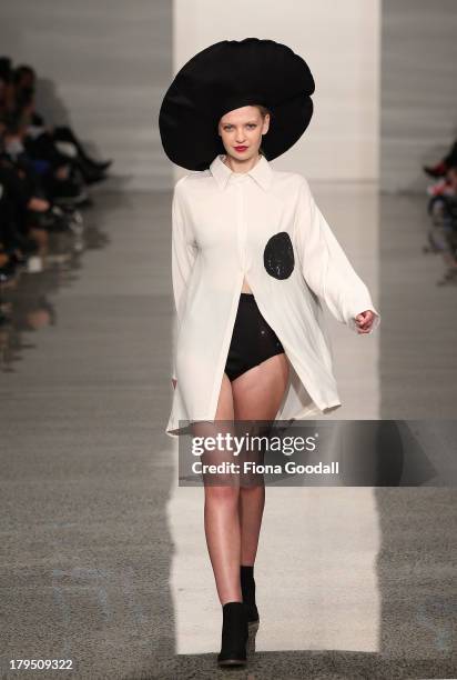 Model showcases designs by Love Hotel on the runway during the NZFD Designer Showcase show during New Zealand Fashion Week at the Viaduct Events...