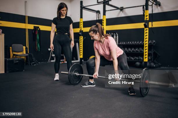 fitness coach with client - deadlift stock pictures, royalty-free photos & images