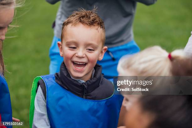 laughing with my teammates - sports bib stock pictures, royalty-free photos & images