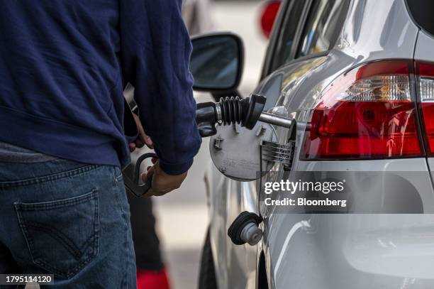 Customer refuels at a Chevron gas station in San Francisco, California, US, on Tuesday, Nov. 21, 2023. The US Thanksgiving travel period is shaping...