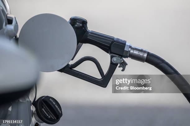 Fuel nozzle at a Chevron gas station in San Francisco, California, US, on Tuesday, Nov. 21, 2023. The US Thanksgiving travel period is shaping up to...