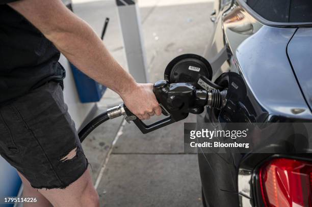 Customer refuels at a Chevron gas station in San Francisco, California, US, on Tuesday, Nov. 21, 2023. The US Thanksgiving travel period is shaping...