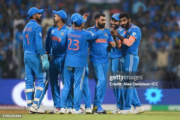 Mohammed Shami of India celebrates with teammates after dismissing Daryl Mitchell of New Zealand during the ICC Men's Cricket World Cup India 2023...