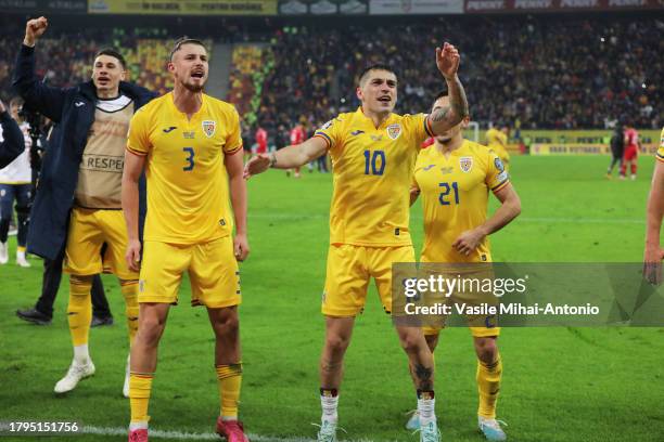 Radu Dragusin of Romani celebrates the qualifying with his teammate Nicolae Stanciu during the UEFA EURO 2024 European qualifier match between...