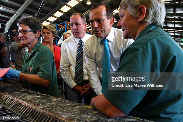 Australian Opposition Leader, Tony Abbott and Deputy Liberal Leader Julie Bishop tour Packer Leather on September 5, 2013 in Brisbane, Australia. The...