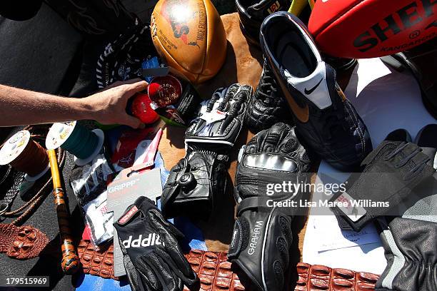 Journalist inspects some leather goods at Packer Leather on September 5, 2013 in Brisbane, Australia. The Liberal-National Party coalition are...
