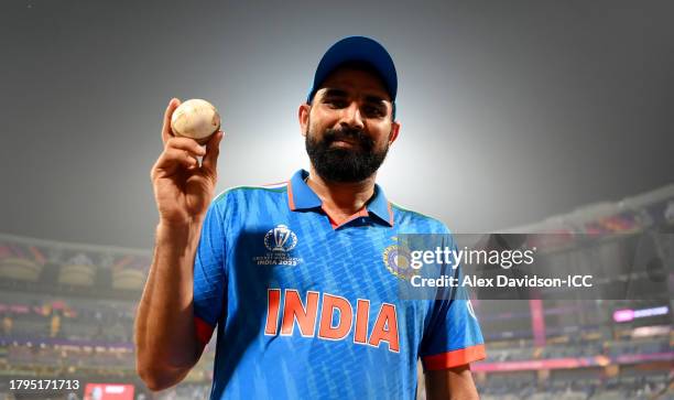 Mohammed Shami of India poses for a photo with the match ball after taking 7 wickets and winning the ICC Men's Cricket World Cup India 2023 Semi...