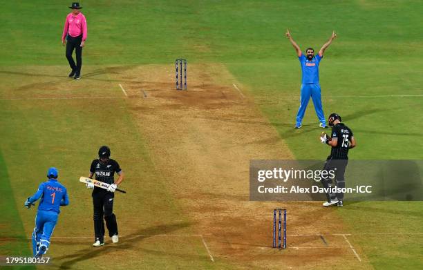 Mohammed Shami of India celebrates after dismissing Daryl Mitchell of New Zealand during the ICC Men's Cricket World Cup India 2023 Semi Final match...