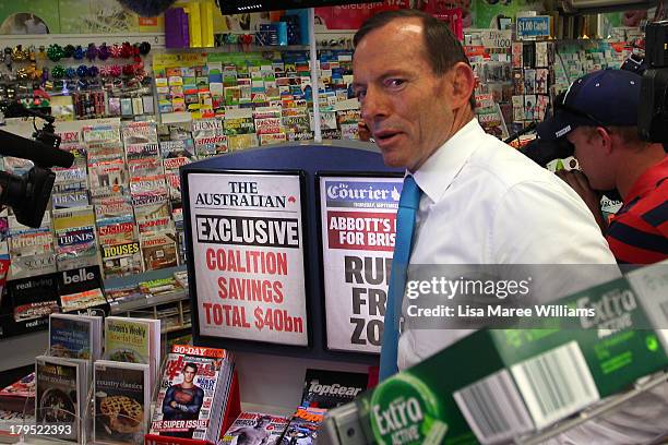 Australian Opposition Leader, Tony Abbott stands in front of newspaper leaders at Stafford Heights on September 5, 2013 in Brisbane, Australia. The...