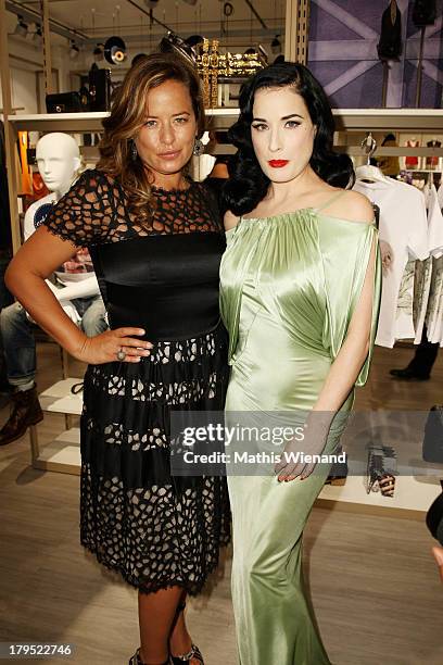 Jade Jagger and Dita von Teese attend the 'Feel London By Karstadt' Launch Event at Karstadt Store Duesseldorf on September 4, 2013 in Dusseldorf,...