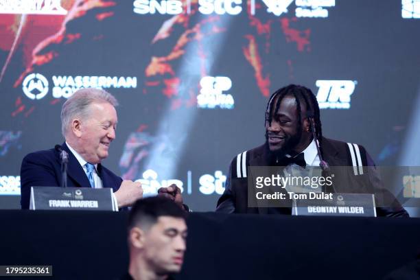 Promoter Frank Warren and Deontay Wilder of United States interact during the Day Of Reckoning Press Conference at OVO Arena Wembley on November 15,...