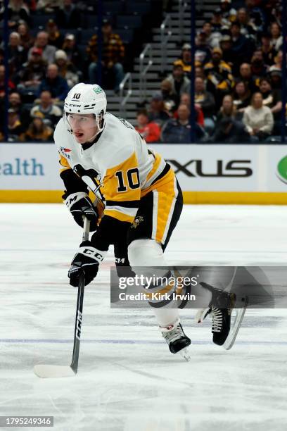 Drew O'Connor of the Pittsburgh Penguins controls the puck during the game against the Columbus Blue Jackets at Nationwide Arena on November 14, 2023...