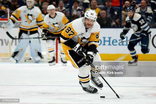 Sidney Crosby of the Pittsburgh Penguins controls the puck during the game against the Columbus Blue Jackets at Nationwide Arena on November 14, 2023...