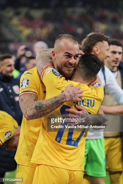 Denis Alibec of Romania celebrates the qualifying with his teammate Nicolae Stanciu during the UEFA EURO 2024 European qualifier match between...