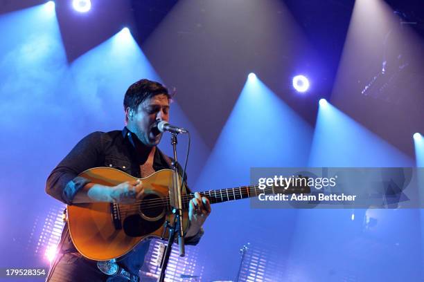 Marcus Mumford of the band Mumford & Sons performs on September 4, 2013 at The Xcel Energy Center in St. Paul, Minnesota.