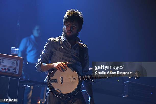 Winston Marshall of the band Mumford & Sons performs on September 4, 2013 at The Xcel Energy Center in St. Paul, Minnesota.