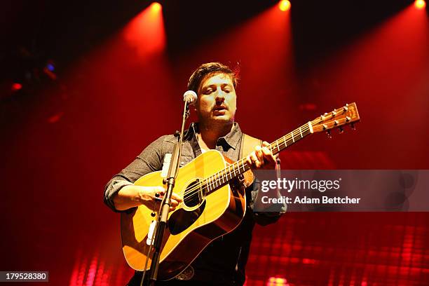 Marcus Mumford of the band Mumford & Sons performs on September 4, 2013 at The Xcel Energy Center in St. Paul, Minnesota.