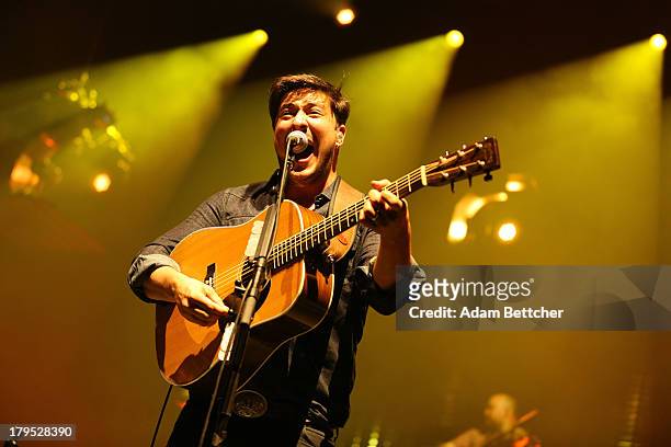 Marcus Mumford of the band Mumford & Sons performs on September 4, 2013 at The Xcel Energy Center in St. Paul, Minnesota.