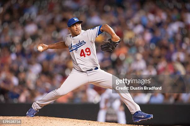 Carlos Marmol of the Los Angeles Dodgers pitches in the seventh inning of a game against the Colorado Rockies at Coors Field on September 4, 2013 in...