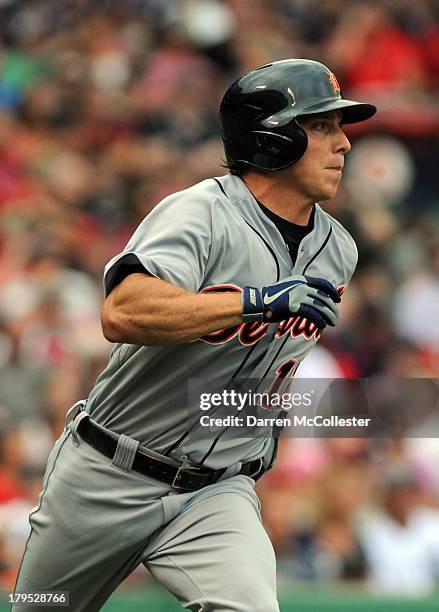 Andy Dirks of the Detroit Tigers runs to first base in the seventh inning against the Boston Red Sox at Fenway Park on September 2, 2013 in Boston,...